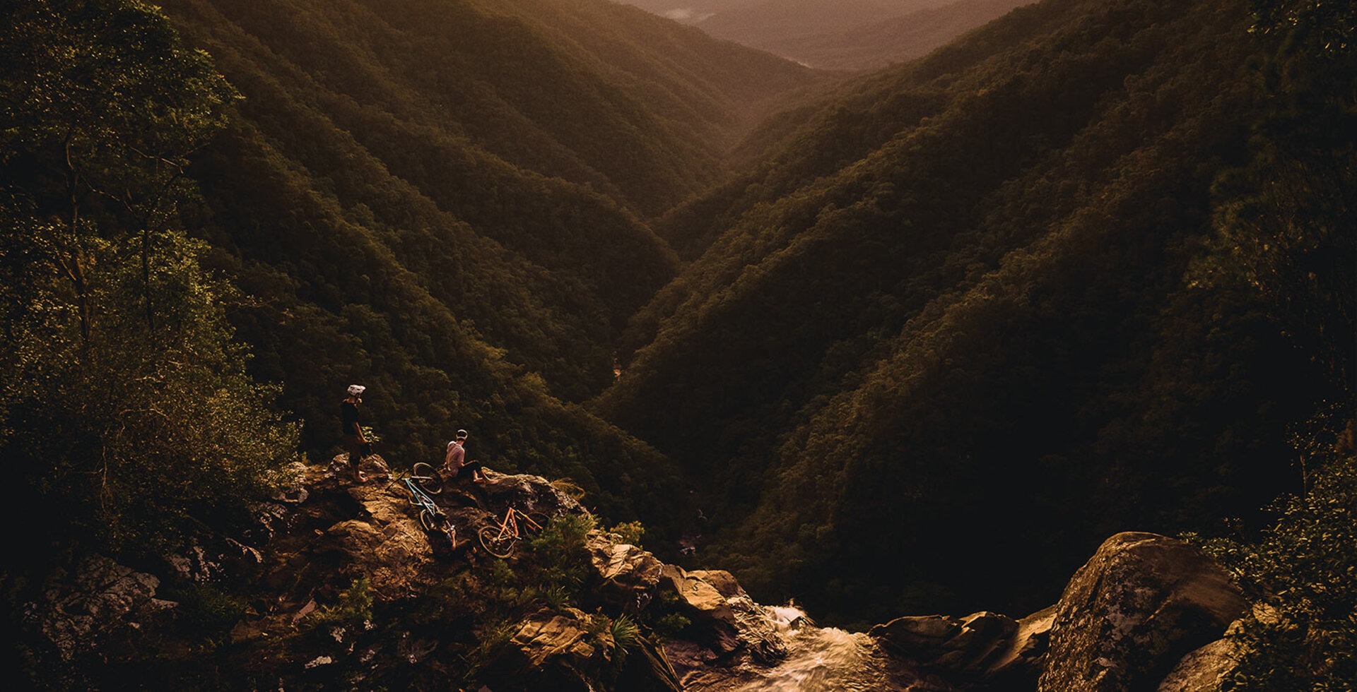 Awash in morning light, Berend Boer, Joel Sutherland and Mel Popov take in the view from Windin Falls in the Wooroonooran National Park south of Cairns.