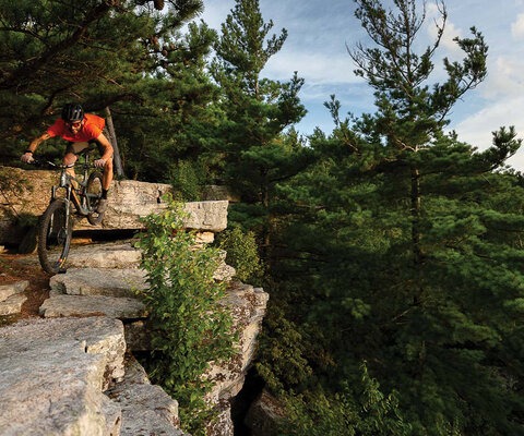 Harrisonburg’s abundance of technical terrain breeds a certain type of rider. Charlie Snyder drops into the overlook on Bird Knob in the northeastern quadrant of the George Washington National Forest.