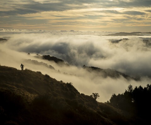 Early mornings at Tamarancho provide stunning views and often empty trails. Vernon Huffman starts the day off right as the clouds roll through the valley. Photo: Jann Eberharter