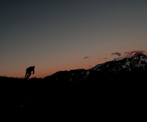 Last turn in the last light. Guide Arno takes advantage of the lingering alpenglow while riding near one of the overnight huts. An illuminated Mont Blanc (out of frame) provided an exceptional sunset view for Arno as he finished the day in style.