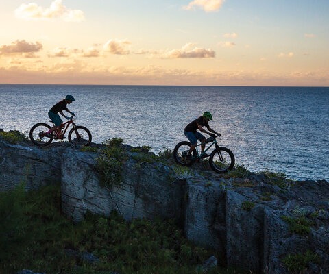 Not much beats cliffside sunset riding in Bermuda. James Holloway shows Brigid Mander some of the local goods.