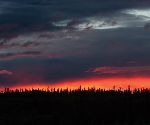 Sunsets in the Yukon never seem to end - which makes sense considering daylight can last 19 hours. A particularly colorful evening, viewed from the hot tub at the Boreale Ranch.