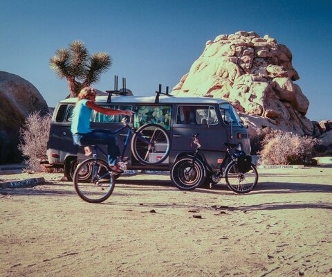 “Dave Wonderly said he always took his mountain bike along when he went climbing in Joshua Tree, a mecca for climbers from around the world, who congregate there every year in the off-season to hone their bouldering skills. For his two-minute sequence, I shot three 100-foot rolls of 16mm film—six minutes total—with my hand-crank Bolex and three fixed lenses in some of Dave's favorite rock formations.” Wonderly wheelies in front of Ruck’s van in 1984, a decade before Joshua Tree was closed to mountain bikes.