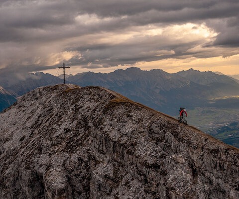 “Matthias Oehlboeck rides the ridgeline from the summit of Nockspitze after spending the night on the mountain. Enjoying a solitary, sunrise view over your hometown only makes you love it more, but with half of Innsbruck’s population being addicted to the outdoors, you’re rarely there by yourself. This particular night we shared the summit with three paragliders, who launched back to the valley the next morning.” Photo: Andreas Vigl