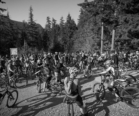 A crowd of two- to three-hundred mountain bikers isn't an uncommon sight at a Toonie race these days. It's far from the ride's humble beginnings, but a testimony to the community it has built. Photo courtesy of Tourism Whistler / Justa Jeskova
