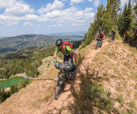 Chad Melis leads Carston Oliver and the rest of a six-person crew across an exposed ridgeline in Montana’s Madison Range.